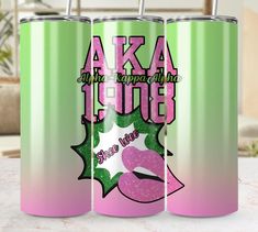 two pink and green tumbles with the words aka to be on them