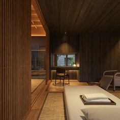 a bed sitting in a bedroom next to a wooden wall