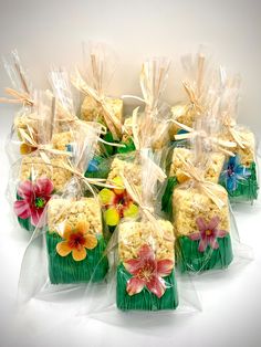 small bags filled with rice krispy treats sitting on top of each other in front of a white background