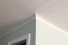 the corner of a room with white painted walls