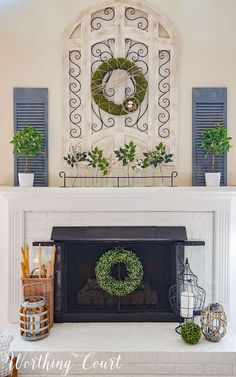 a fireplace with a wreath on the mantle