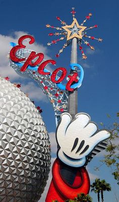 the entrance to mickey mouse's epico land in disney world is decorated with red, white and blue letters