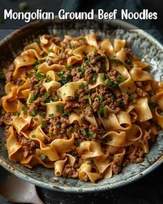 a bowl filled with noodles and ground beef