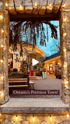 the entrance to ontario's prettiest town is lit up with christmas lights