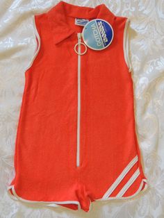 BONDS Brand Gotcha by BONDS  - Made in Australia Red Short Jumpsuit, White stripe detail Child Size 4 - 100cm Height  (39inch) Play suit / Jumpsuit / Bodysuit 1970's Curved leg short Ring pull zipper front Lightweight Towelling, very soft Cotton / Nylon Actual length of garment - 47cm - 18 inch Rare Find Vintage - New with Tag - Ex Shop Stock Take note of washing instructions, colour may run. Short Jumpsuit Outfit, Jumpsuit Shorts, Rare Clothing, Play Suit, Jumpsuit White, Suit Jumpsuit, Body Suit With Shorts, Retro Kids, Jumpsuit Outfit