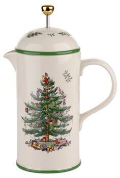 a white and green coffee pot with a christmas tree on it