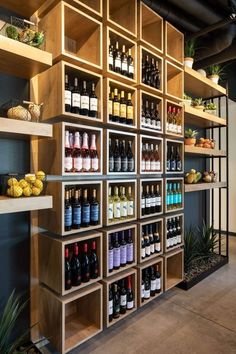 the shelves are filled with bottles of wine