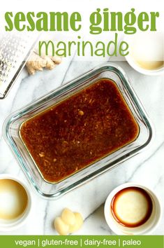 the recipe for sesame ginger marinade is in a glass casserole dish on a marble countertop