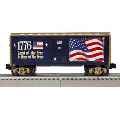 a toy train with an american flag painted on it's caboose and the words land of the free