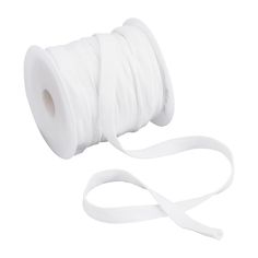 a roll of white satin ribbon with a spooled end on the top and one side