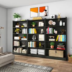 a living room filled with lots of bookshelves next to a couch and coffee table