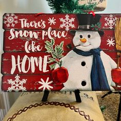 a wooden sign with a snowman on it that says, there's snow place for home