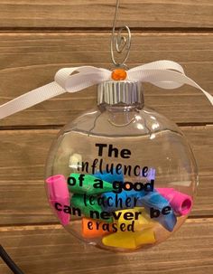 a glass ornament with writing on it