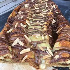 there is a pastry with chocolate and nuts on it