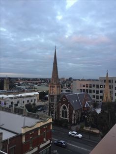 a church steeple towering over a city