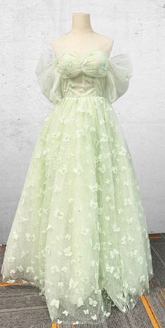 Celebrate your quinceanera in dreamy boho elegance with this enchanting light green A-line dress. This dress is crafted from layers of light tulle fabric, and the floor-length skirt flows effortlessly, creating a graceful and ethereal silhouette. The sweetheart neckline and short sleeves offer a soft, romantic appeal, perfectly blending tradition and modern charm. The delicate lace appliques and shimmering sequins adorn the dress, adding intricate detail and a touch of sparkle to your special lo Dress With Petticoat, Garden Wedding Dress, Green Floor, Spring Garden Wedding, Garden Wedding Dresses, White Homecoming Dresses, Blue Homecoming Dresses, Green Flooring, Theme Dress