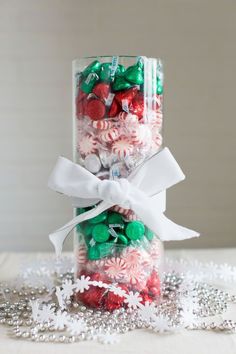 a glass jar filled with candy and candies