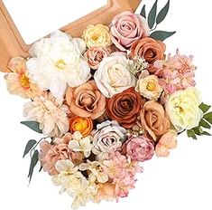 an arrangement of flowers in a wooden box