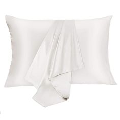 two white pillows and one is folded up