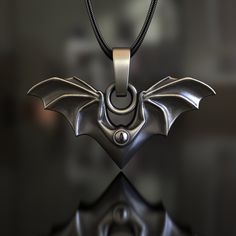 Embrace the allure of the night with our expertly handcrafted Bat Wings Pendant, made from high-quality 925 Sterling Silver. This unique necklace features detailed bat wings, symbolizing transformation, rebirth, and the mysterious elements of life, making it a meaningful accessory for those who appreciate these mystical values. Our skilled artisans have expertly crafted this pendant to capture the intricate details of bat wings, ensuring that each piece serves as a tribute to the wearer's apprec Winged Demon, Elements Of Life, Gothic Mode, Wings Pendant, Retro Necklaces, Silver Necklaces Women, Gothic Necklace, Mens Silver Necklace, Pet Necklace