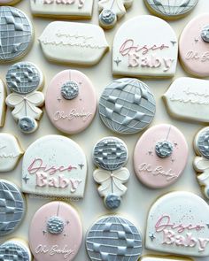 decorated cookies are arranged in the shape of hot air balloons and baby's names