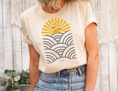 Boho sunset t-shirt, Minimalist t-shirt, Neutral Landscape, Adventure t-shirt, Abstract Mountain and Sun t-shirt SIZING -Please see size charts in the images above. Measure a favorite shirt from seam to seam and compare to get the fit you want. -Our t-shirts are a comfy unisex fit, for a FITTED look order ONE SIZE DOWN HOW TO CARE FOR YOUR T-SHIRT Machine Wash Warm, Inside Out, With Like Colors. Only Non-Chlorine Bleach. Tumble Dry Low. A very warm welcome to my SmashGlam Store! As a child, I ha Beach Tees For Women, Summer Tee Shirt Designs, Summer T Shirt Ideas, Trendy T Shirts For Women 2023, Beach Tee Shirts, Vintage Beach Shirt, Beach Graphic Tees, Summer T Shirts Women, Cute Summer T Shirts