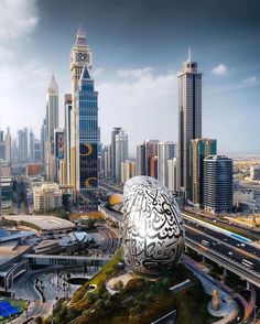 an egg shaped building in the middle of a large city with tall buildings behind it