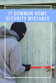 a person wearing a hoodie and holding a hammer in front of a wooden door