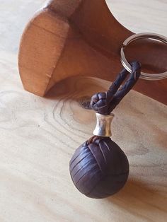 a wooden object with a metal ball on it