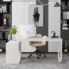 a white desk sitting in front of a bookshelf filled with lots of shelves