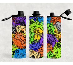 two water bottles with different colored video game controllers on them, one is black and the other is multicolored