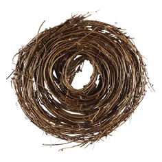 a round wreath made out of twigs on a white background