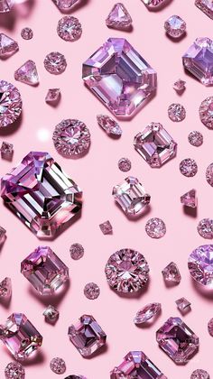 many different colored diamonds on a pink background