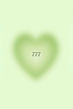 a green heart shaped object with the number 777 on it's left side