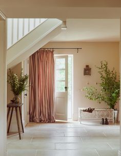 an instagram photo of a room with pink curtains