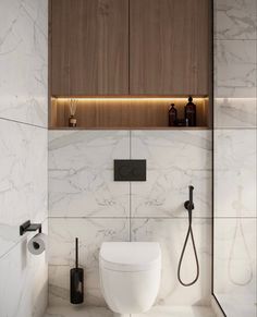 a modern bathroom with marble walls and flooring