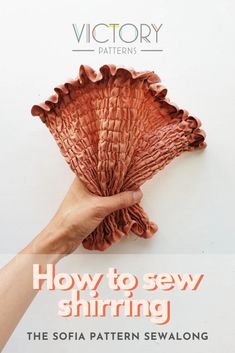 a hand holding a piece of fabric with the words how to sew shining on it