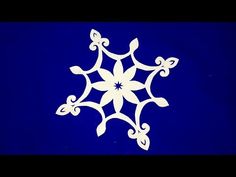 a white snowflake on a blue background