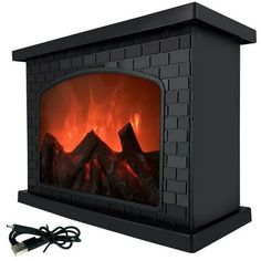 an electric fireplace that is black and has flames on the side, with wires plugged in