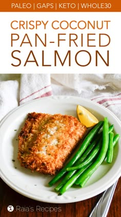 crispy coconut pan - fried salmon with green beans and lemon on a white plate