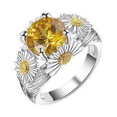 a yellow diamond ring with daisies on it