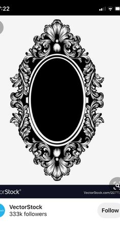 an ornate black and white oval frame with floral ornames on the edges,