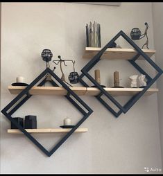 two shelves with candles and vases on them in the shape of hexagonal shapes