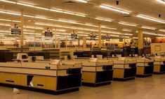 an empty computer lab with lots of desks