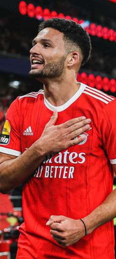 a soccer player with his arms around him