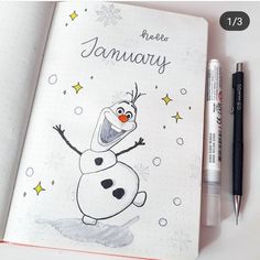 an open notebook with a drawing of a cartoon character on it and a pen next to it