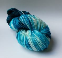 a skein of blue and white yarn