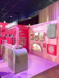 a pink booth with lots of items on display