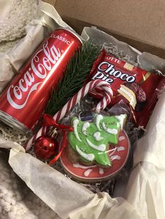 a box filled with assorted candy and cookies