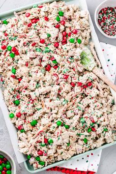 a pan filled with christmas sprinkles and candy